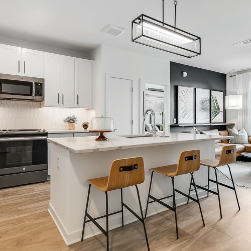 a kitchen with white cabinets