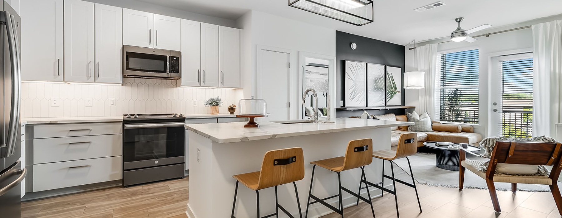 a kitchen with white cabinets