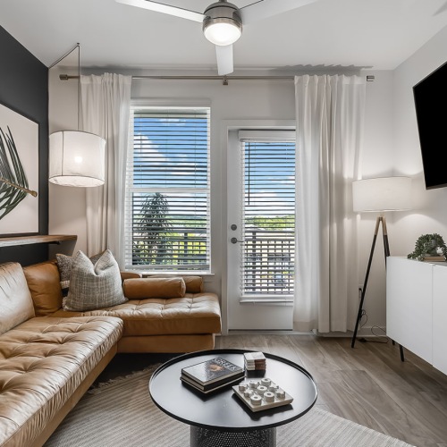 a living room with a couch and a tv