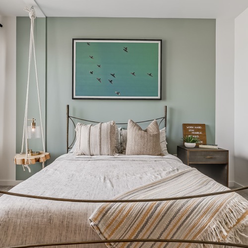 a bedroom with a bed and a nightstand