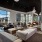 natural lighting pours through large paneled windows in piano lounge
