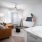 ceiling fan and lighting in living room open to kitchen